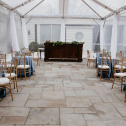 An outdoor tent venue for an event on a rainy day